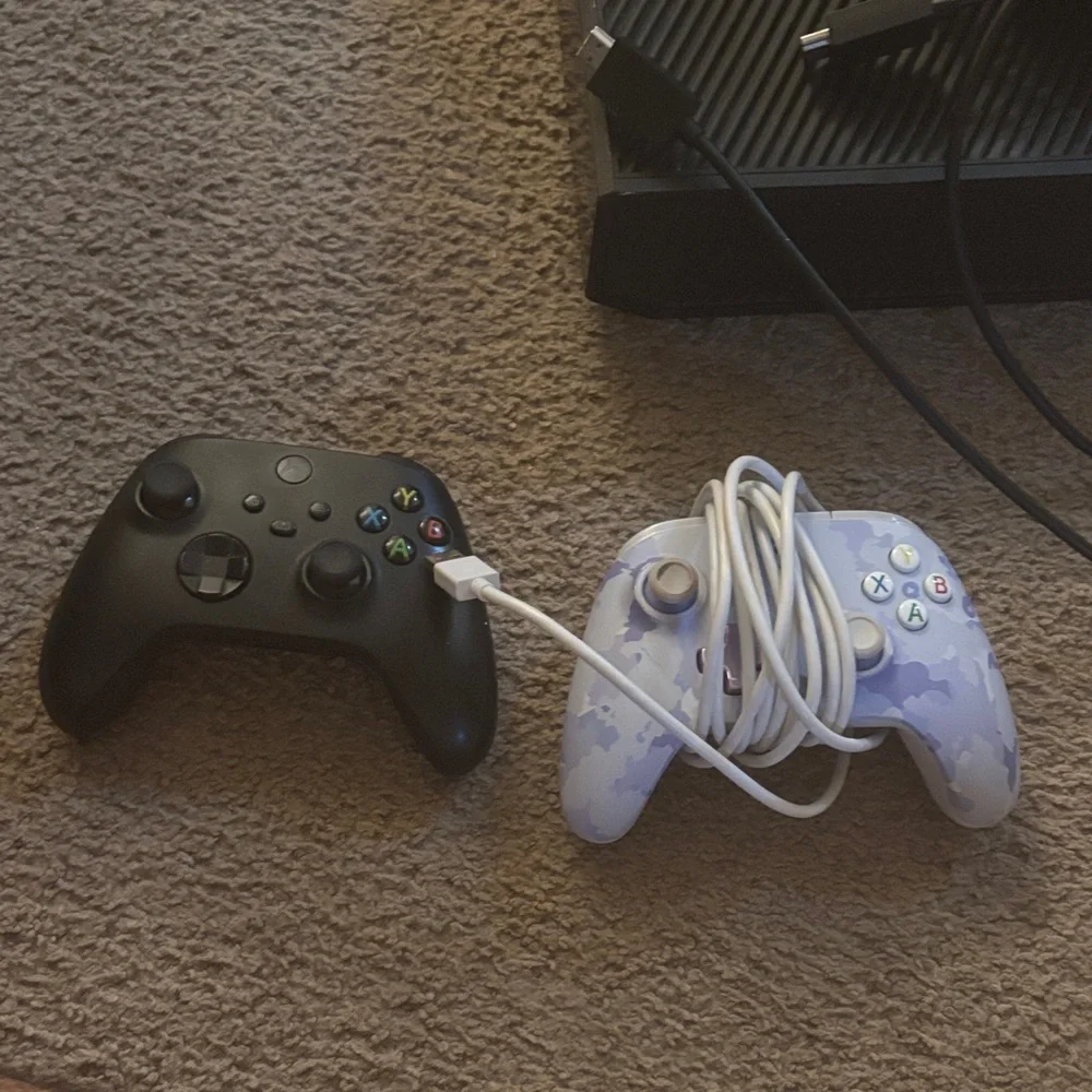 One Black Console Bundle with Black and White Controllers